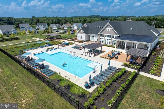 pool with a gazebo, fence, and a pergola