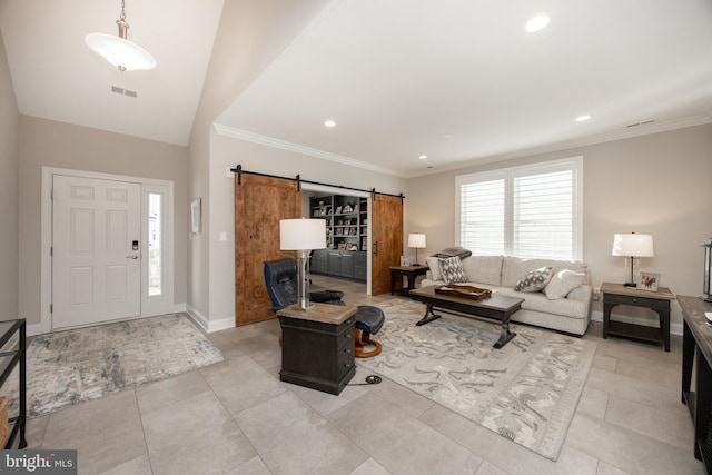 living area with crown molding, recessed lighting, a barn door, and visible vents