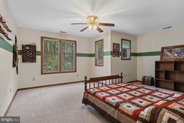 carpeted bedroom featuring visible vents and baseboards