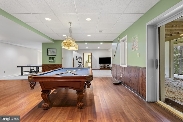 playroom with billiards, wainscoting, a drop ceiling, and wood finished floors