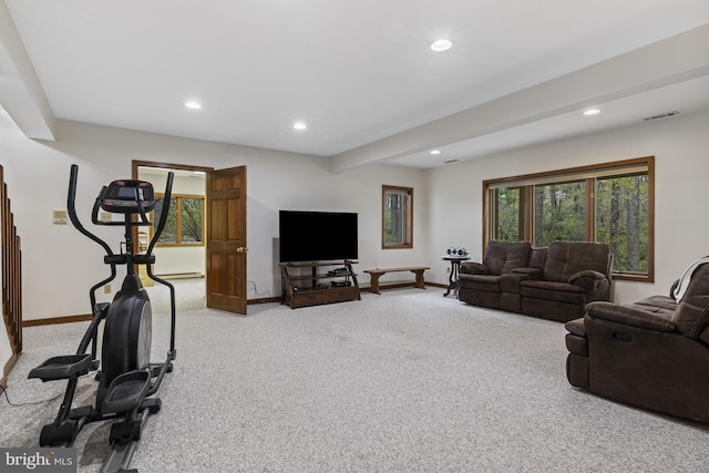 living room with visible vents, recessed lighting, baseboards, and light carpet