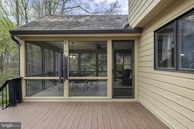 wooden deck featuring a sunroom