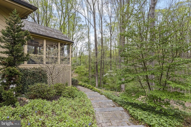 view of yard featuring a sunroom