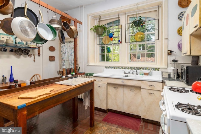 interior space featuring a sink and brick floor