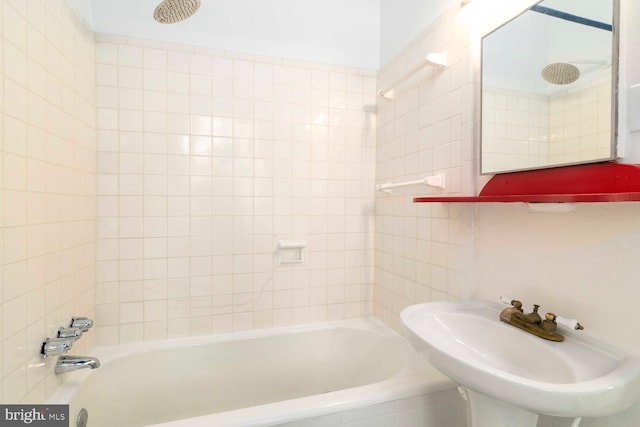 bathroom with a sink and shower / bathing tub combination