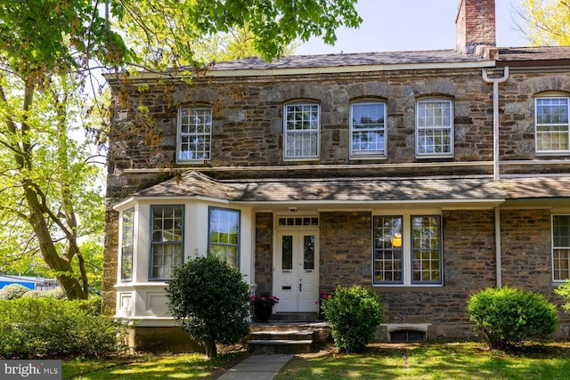 view of front of house with a chimney