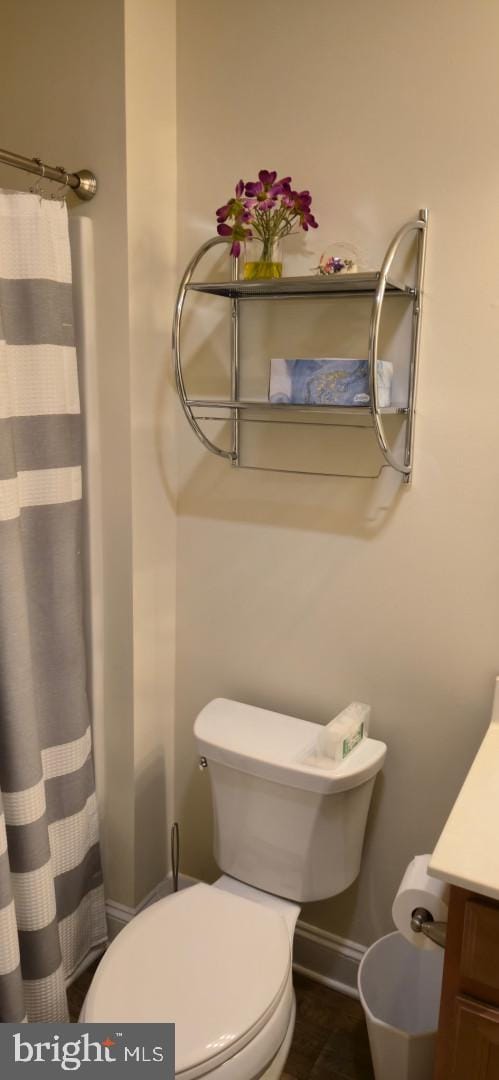 24840 Mistletoe Dr, Georgetown, DE 19947 - full bath featuring vanity, toilet, and a shower with shower curtain