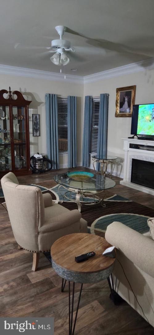 24840 Mistletoe Dr, Georgetown, DE 19947 - living room with crown molding, ceiling fan, and wood finished floors
