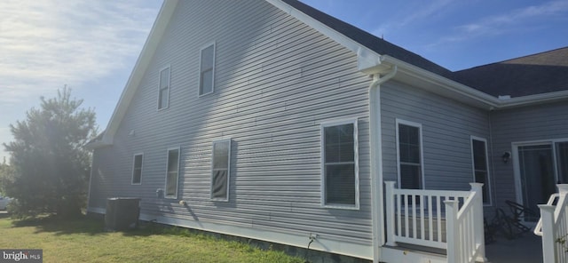 24840 Mistletoe Dr, Georgetown, DE 19947 - view of property exterior with a yard and central AC unit