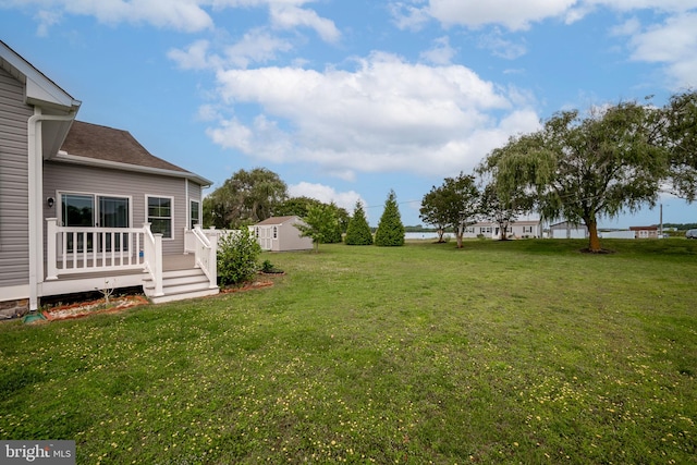 24840 Mistletoe Dr, Georgetown, DE 19947 - view of grassy yard with a wooden deck