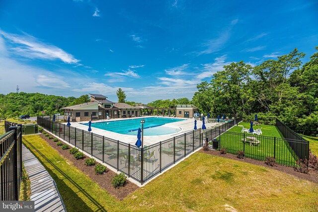 8456 Randell Ridge Rd, Frederick, MD 21704 - pool featuring a patio, fence, and a lawn