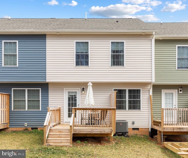 back of property featuring a shingled roof, a deck, crawl space, central AC unit, and a yard