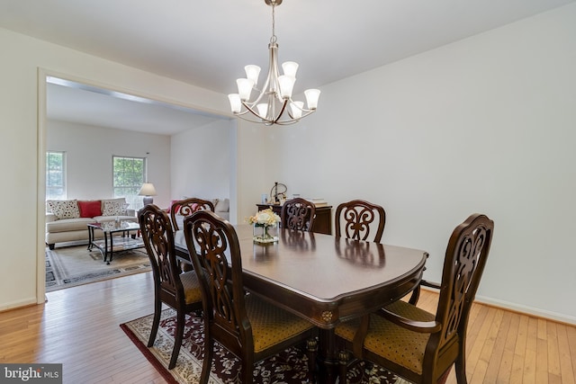 3001 Mandarin Pl, Waldorf, MD 20603 - dining room with baseboards, light wood-style flooring, and a chandelier