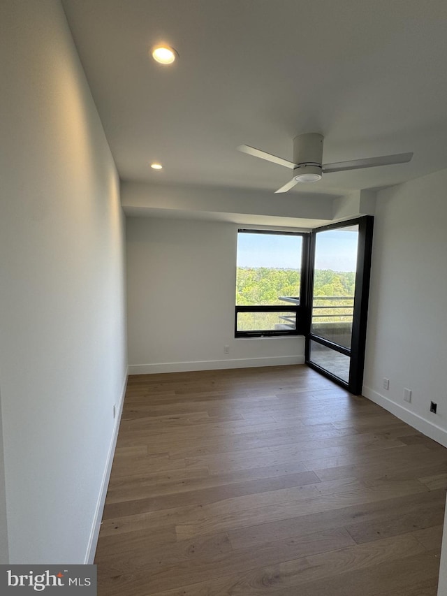 unfurnished room with recessed lighting, baseboards, ceiling fan, and wood finished floors