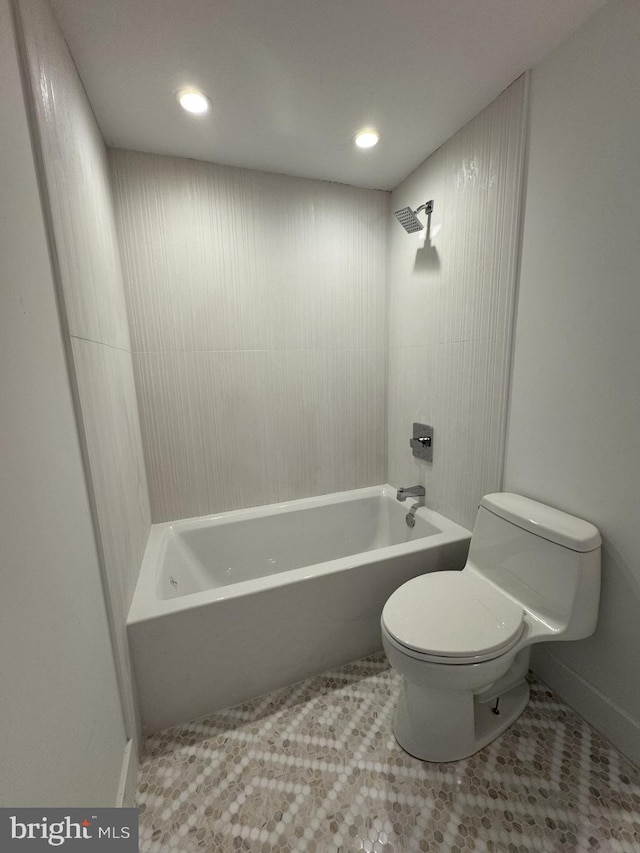 bathroom featuring toilet, tile patterned floors, recessed lighting, and tub / shower combination