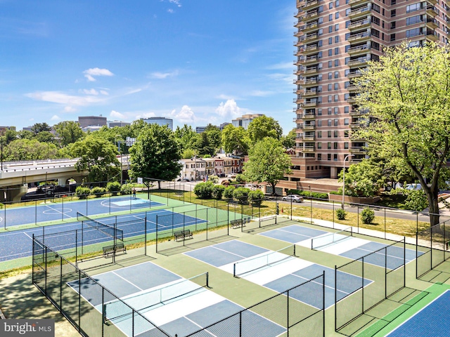 view of tennis court featuring fence