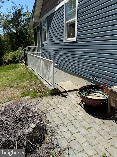 view of side of home featuring a patio area