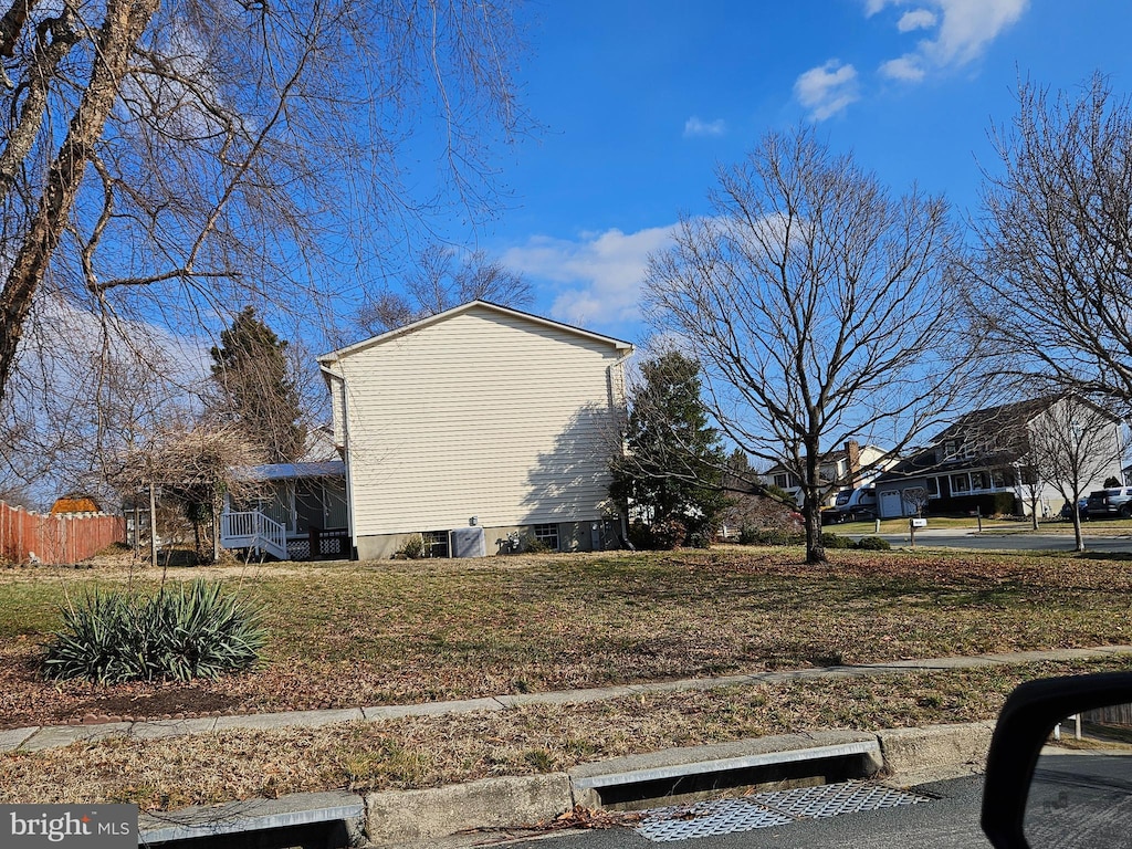 view of side of home with fence