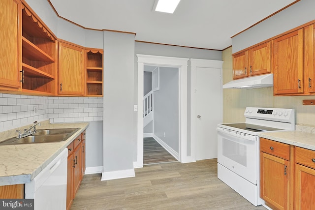 kitchen featuring open shelves, a sink, white appliances, light countertops, and under cabinet range hood
