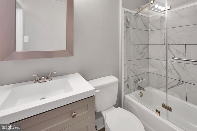 bathroom with vanity, tub / shower combination, and toilet