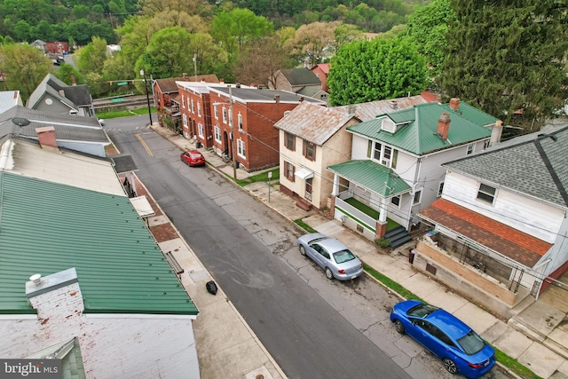 birds eye view of property with a view of trees