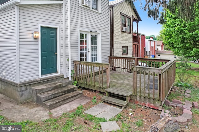 wooden terrace with entry steps and french doors