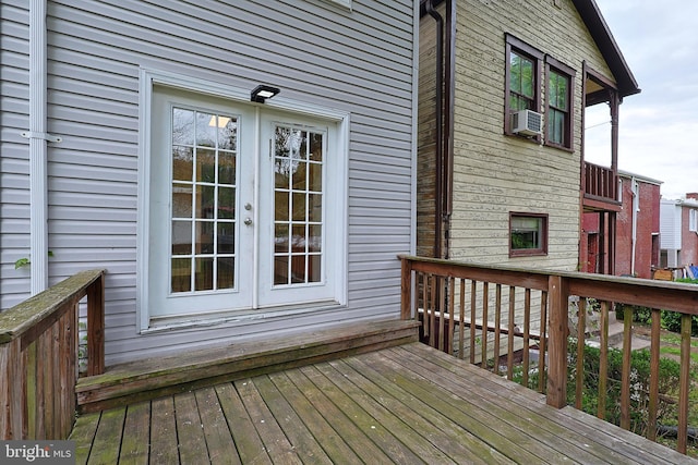 wooden terrace featuring cooling unit