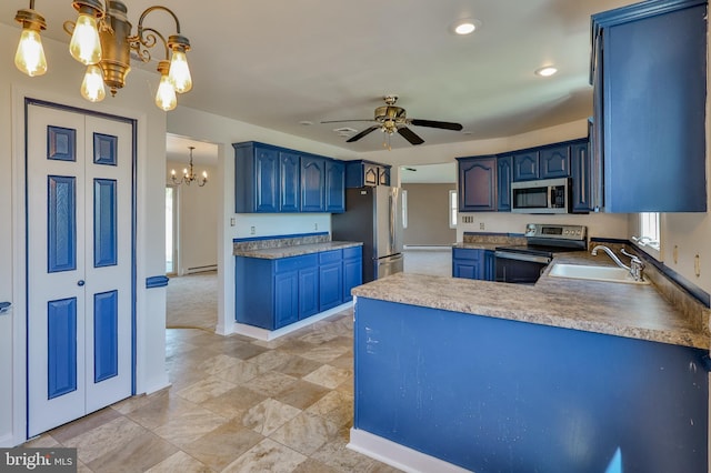 3 Dusty Rd, Easton, PA 18045 - kitchen with a sink, appliances with stainless steel finishes, a peninsula, and blue cabinetry