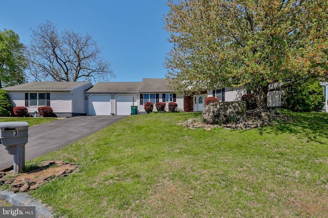3 Dusty Rd, Easton, PA 18045 - single story home with an attached garage, a front yard, and aphalt driveway