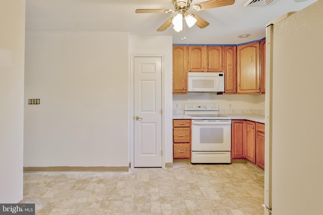 3 Dusty Rd, Easton, PA 18045 - kitchen featuring light countertops, brown cabinets, ceiling fan, and white appliances