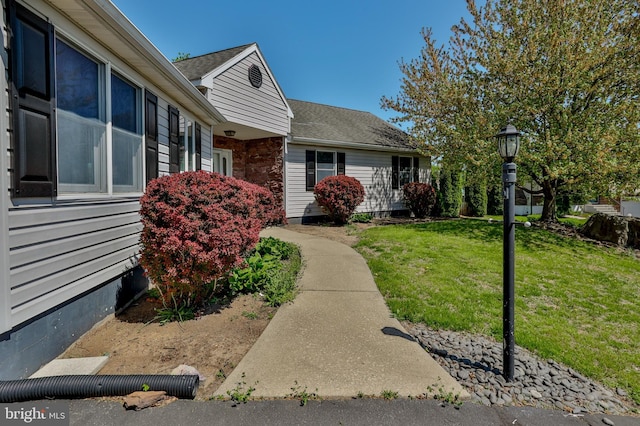 3 Dusty Rd, Easton, PA 18045 - view of exterior entry featuring a lawn and a shingled roof