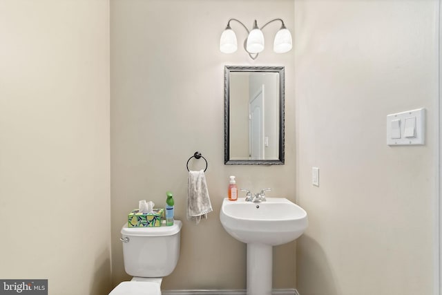 bathroom with a sink and toilet
