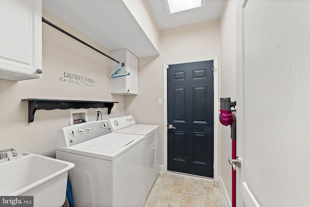 washroom with stone finish flooring, independent washer and dryer, cabinet space, a sink, and baseboards
