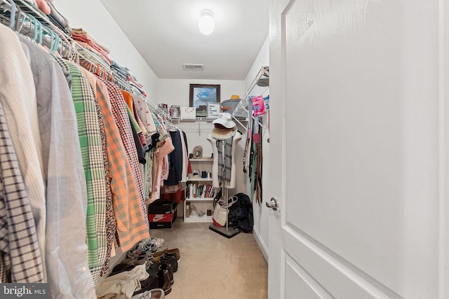 walk in closet with carpet floors and visible vents