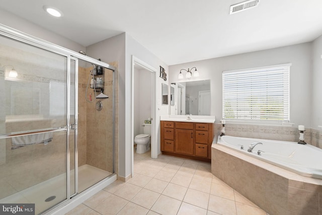 bathroom featuring vanity, tile patterned flooring, a shower stall, and visible vents