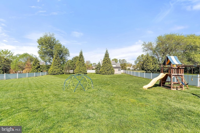 view of yard with a fenced backyard and a playground