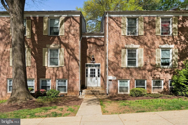 view of front of property featuring brick siding and entry steps