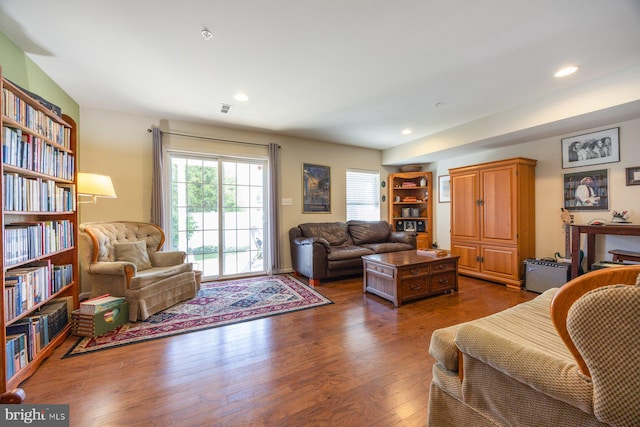 living area featuring recessed lighting, wood finished floors, and visible vents