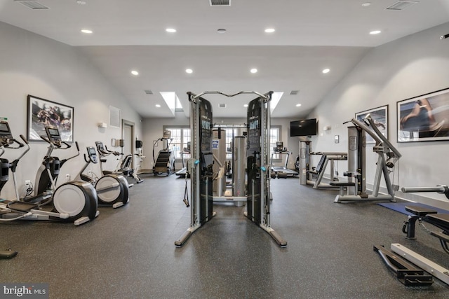 exercise room featuring visible vents, recessed lighting, and vaulted ceiling