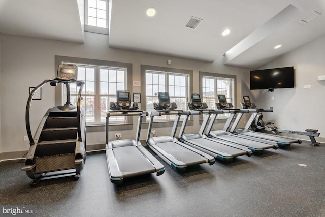 gym featuring recessed lighting, baseboards, visible vents, and vaulted ceiling