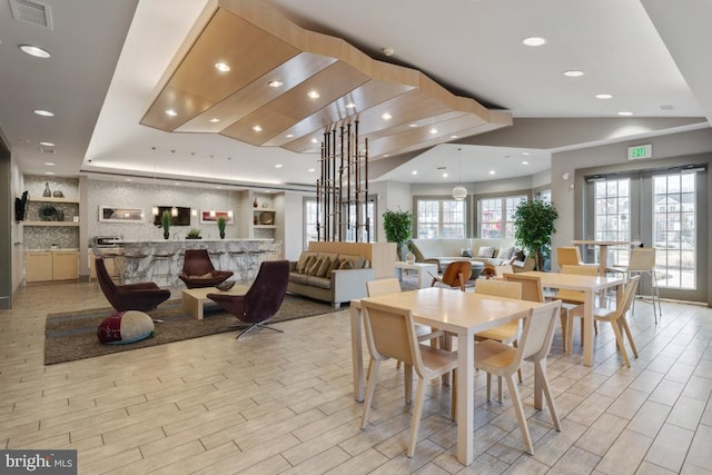 dining space with visible vents, recessed lighting, and light wood finished floors