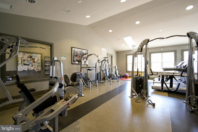 exercise room featuring recessed lighting, vaulted ceiling, and visible vents