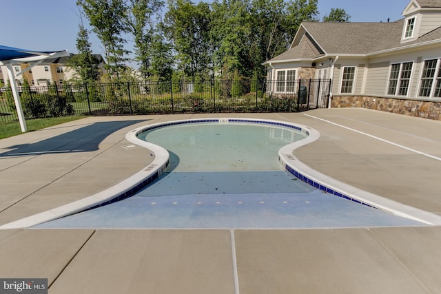 view of pool featuring fence, a fenced in pool, and a patio area