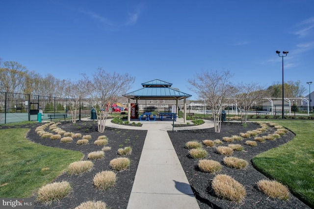 view of property's community with a gazebo and fence