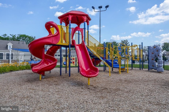 communal playground featuring fence