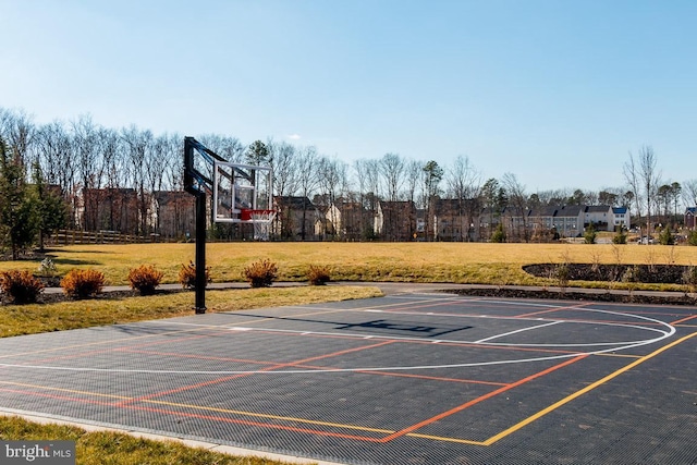 view of basketball court with a yard and community basketball court