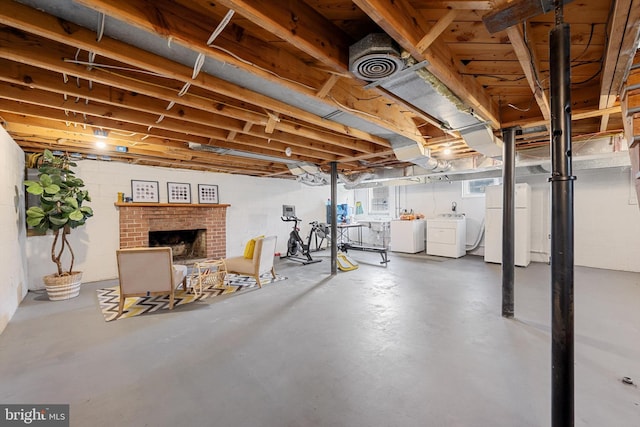 435 Mosby St, Winchester, VA 22601 - basement featuring separate washer and dryer, freestanding refrigerator, and a fireplace