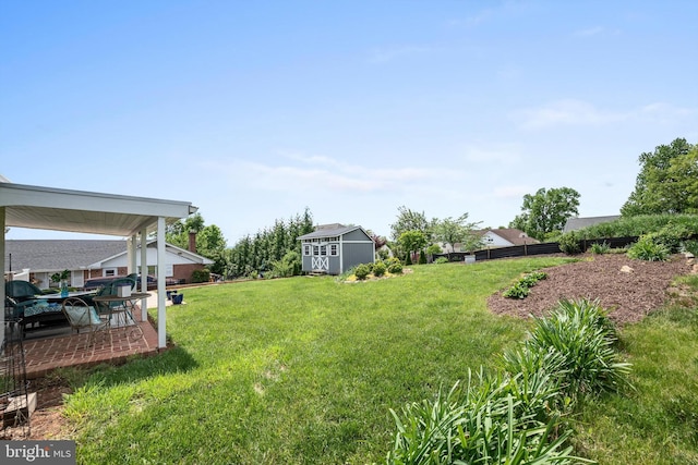 435 Mosby St, Winchester, VA 22601 - view of yard featuring an outbuilding, a shed, and a patio
