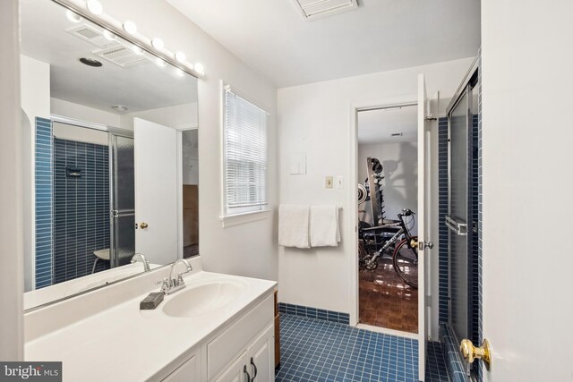 1219 Potomac School Rd, Mclean, VA 22101 - full bathroom with visible vents, a shower with shower door, tile patterned floors, and vanity
