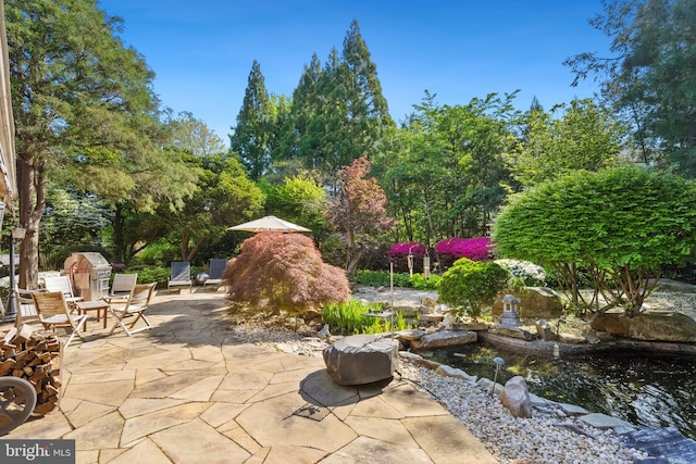 1219 Potomac School Rd, Mclean, VA 22101 - view of patio / terrace with a small pond